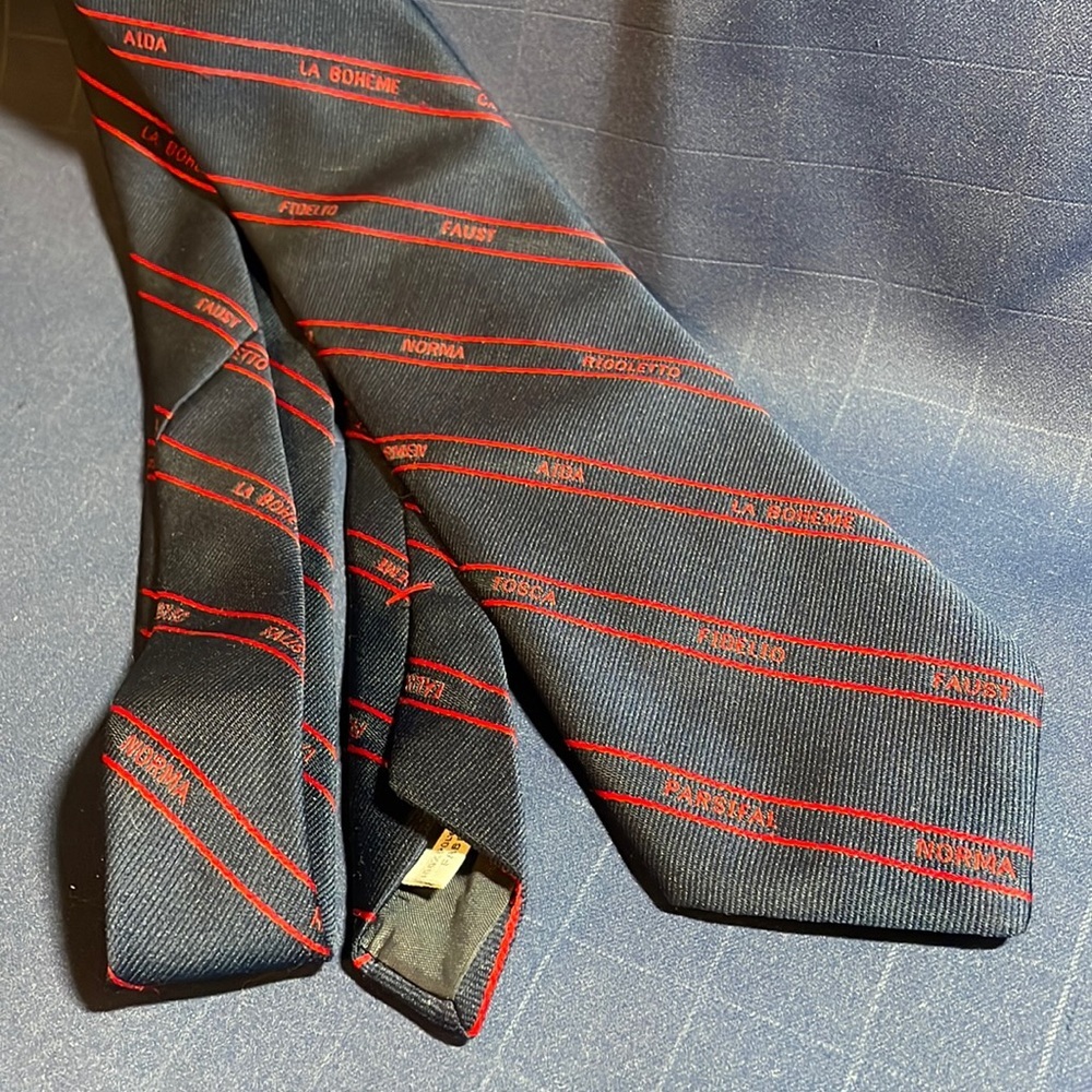 VTG navy blue necktie w/ opera titles patterns stitched in red
